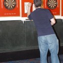 Bar Patrons Darts at Cue's in Marietta