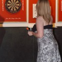 Bar Patrons Darts at Cue's in Marietta