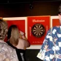 Bar Patrons Darts at Cue's in Marietta